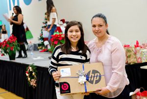 Barrio Logan College Institute senior Daniela Gonzalez (pictured with mom Karla Vazquez), received a laptop from HP in December to help her with school work at home. 