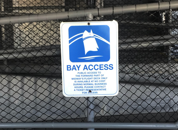 Midway access sign