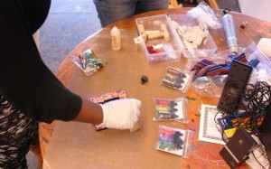 Monica colorizes her metal embossed frame.