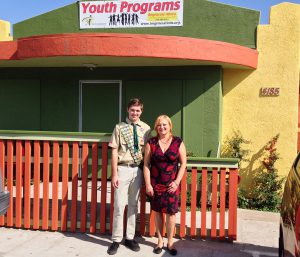 Zara Marselian, Chief Executive Officer of La Maestra Community Health Centers and Eagle Scout Derek Fisher in front of the newly completed railing system for the  La Maestra Foundation Generations Teen Center After-School Program.