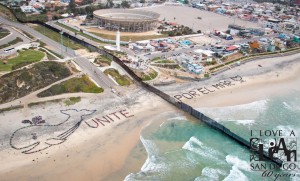 On February 26, for the first time in history, students from the United States and Mexico created a binational message of unity to protect our oceans and waterways. KIDS UNITE! brought together 1,200 students from 7 elementary schools in San Diego and one high school in Tijuana. Students first participated in a beach cleanup at Borderfield State Park and Playas de Tijuana before forming a giant aerial art formation in the sand, which was photographed from the helicopter above. I Love A Clean San Diego, an environmental nonprofit serving San Diego since 1954, coordinated the effort in both San Diego and Tijuana, with help from almost a dozen partners. This program is an initiative of the California Coastal Commission and Kids’ Ocean Day. 